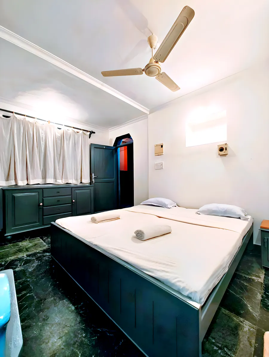 The quiet room: the bed and the painted wall