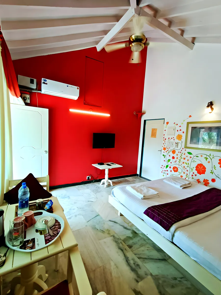 The red room: the bed and the painted wall