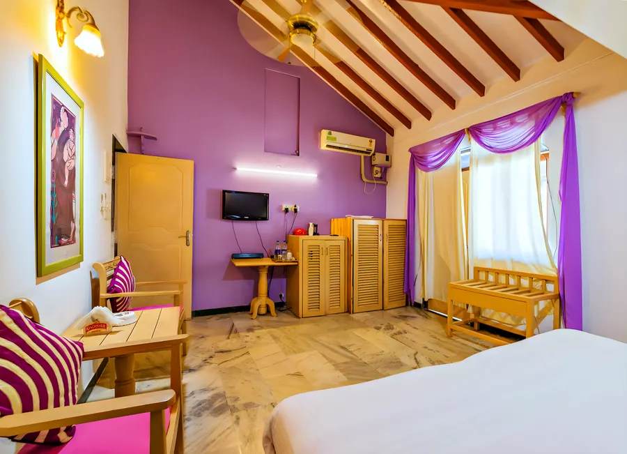 The lilac room: the bed and the painted wall